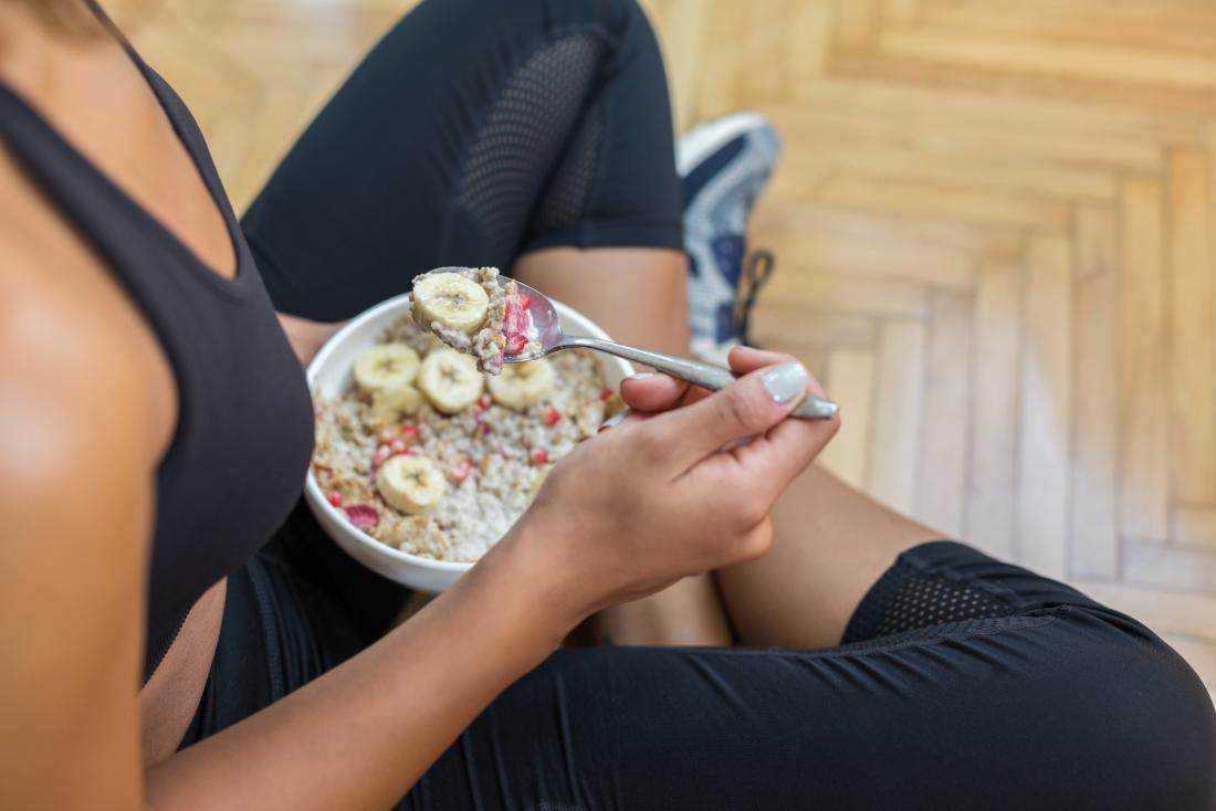 woman-eating-breakfast-in-workout-clothes.jpg
