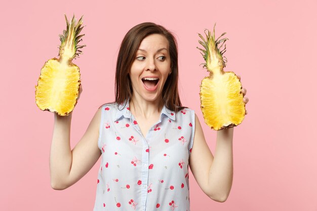 cheerful-young-woman-summer-clothes-looking-aside-holding-halfs-fresh-ripe-pineapple-fruit-isolated-pink-pastel-background-people-vivid-lifestyle-relax-vacation-concept-mock-up-copy-space_365776-24877.jpg