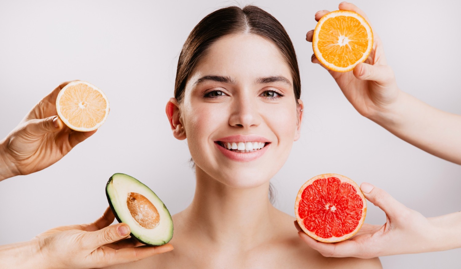 61f11526df94b0eeb2443f38_healthy-beautiful-radiant-skin-woman-without-makeup-portrait-girl-smiling-against-wall-fruits.jpeg